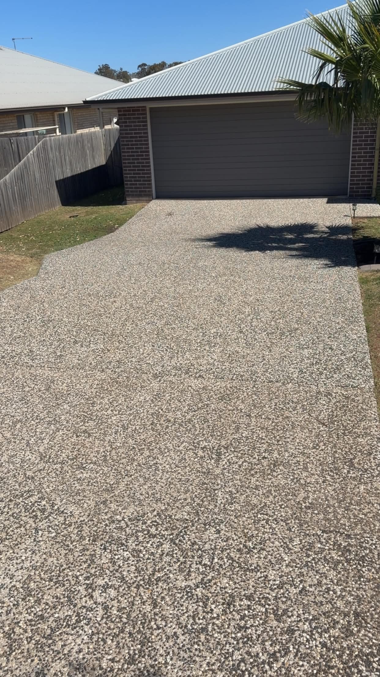 Clean exposed aggregate driveway after wash