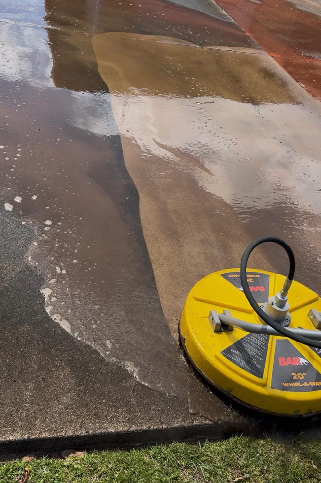 Surface cleaner in action on concrete